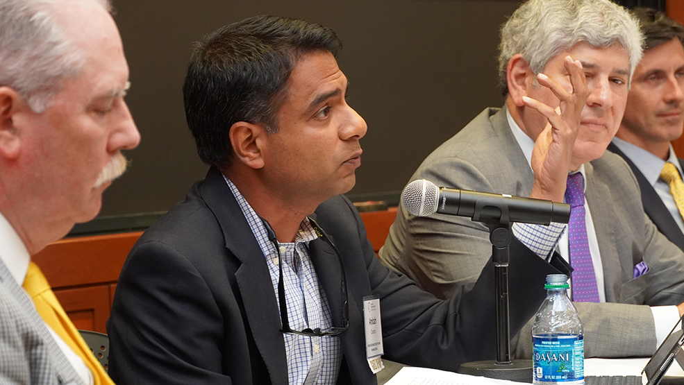 Amitabh Chandra speaking during panel discussion.