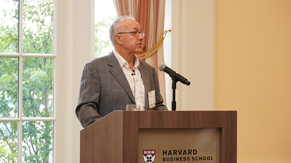 George Daley speaking at podium.