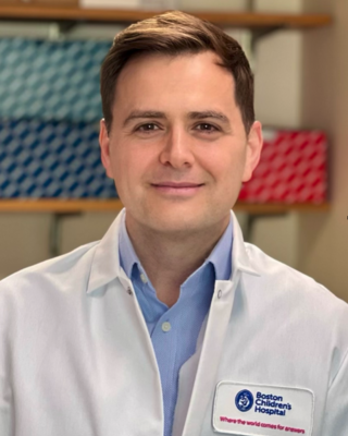 Person wearing a white lab coat